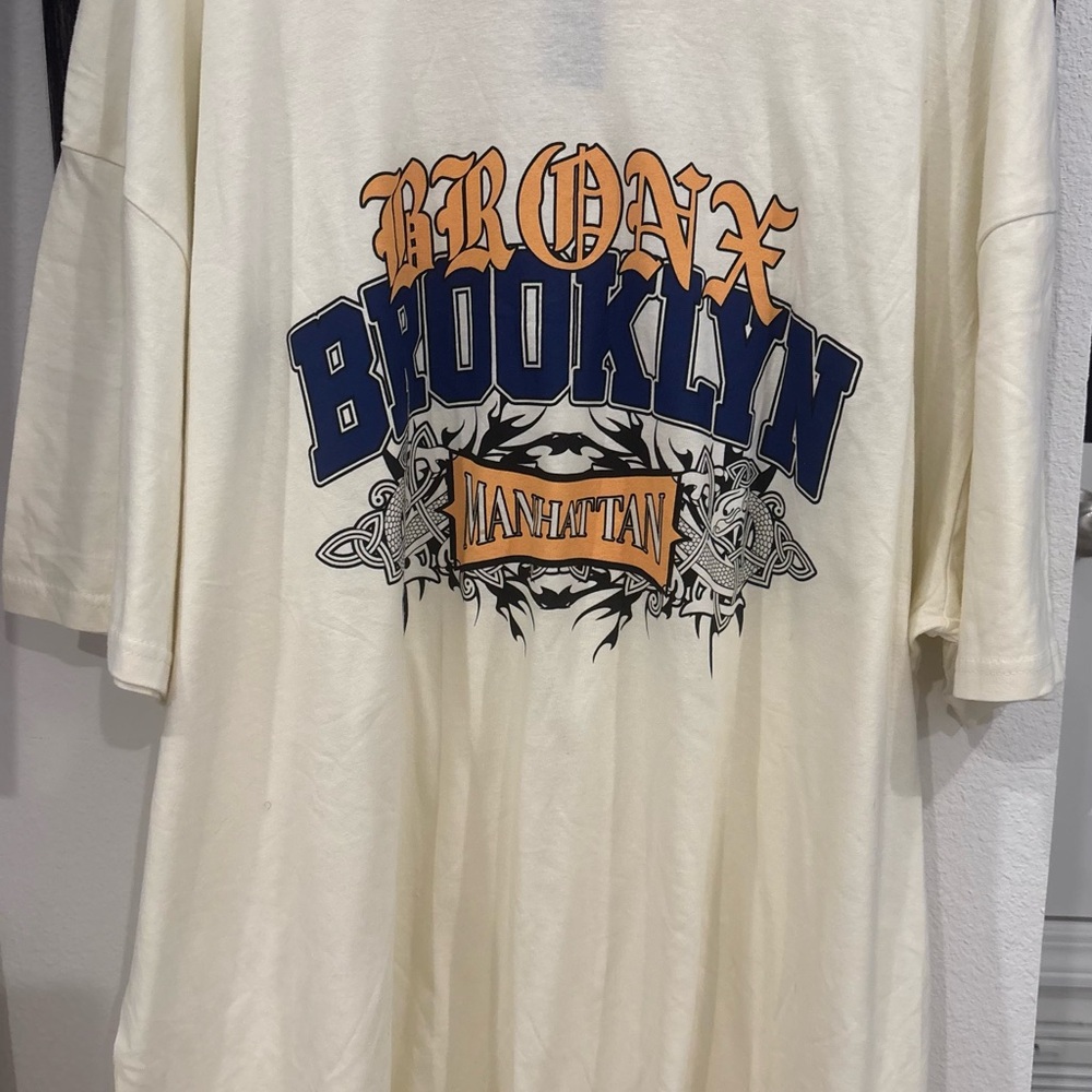 Boohoo Cream Graphic Tee with Blue and Orange Accents